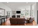 Bright living room features a fireplace, large windows, and hardwood floors at 115 Union Chapel Dr, Mooresville, NC 28117