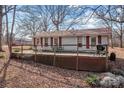 House exterior with deck and wooded setting at 11745 Stokes Ferry Rd, Gold Hill, NC 28071