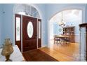 Bright entryway with hardwood floors and views to dining room at 119 Barton Pl, Mooresville, NC 28117