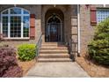 Brick front porch with a double door entry and sidelights at 119 Barton Pl, Mooresville, NC 28117