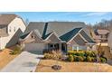 Aerial view of a house with a two-car garage and manicured lawn at 12904 Vermillion Xing, Huntersville, NC 28078