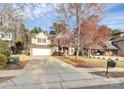 View of the home showcasing its brick and siding exterior with the driveway and mailbox at 2327 Axford Ln, Matthews, NC 28105