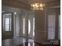 Bright foyer featuring decorative columns, neutral walls, and natural light at 2327 Axford Ln, Matthews, NC 28105