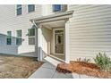 A welcoming front entrance with a well-lit porch and neutral siding at 260 Laura Elizabeth Ln, Clover, SC 29710