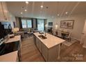 Open kitchen with island and white quartz countertops at 268 Laura Elizabeth Ln, Clover, SC 29710