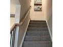 Carpeted staircase with modern railing leading to the upper level at 280 Laura Elizabeth Ln, Clover, SC 29710