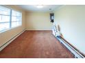 Sun-filled living room with carpet floors and chairlift and baseboard trim at 2905 Maryland Ave, Kannapolis, NC 28083