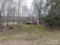 Attractive brick home nestled on a spacious lot with mature trees offering privacy and a serene setting at 298 Upper Stanley Rd, Stanley, NC 28164