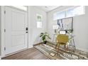 Bright office space with large window, white walls, and modern rug perfect for a productive work environment at 3038 Finchborough Ct # 234, Charlotte, NC 28269