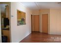 Galley kitchen with pass-through window and stainless steel appliances at 3300 Bendwood Rd, Newton, NC 28658