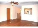 Open living room with hardwood floors and pass-through kitchen view at 3300 Bendwood Rd, Newton, NC 28658