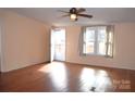 Bright living room with hardwood floors and ceiling fan at 3300 Bendwood Rd, Newton, NC 28658