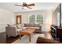 Cozy living room with hardwood floors, a large window, and comfortable seating at 3531 Enfield Rd, Charlotte, NC 28205