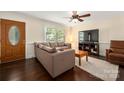 Cozy living room with hardwood floors, a large window, and comfortable seating at 3531 Enfield Rd, Charlotte, NC 28205