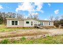 Single-story home featuring neutral siding, white windows, and a ramp to a small front porch at 354 Baptist Church Rd, Gold Hill, NC 28071