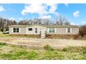 Single-story home featuring neutral siding, white windows, and a small front porch at 354 Baptist Church Rd, Gold Hill, NC 28071