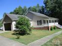 House exterior with attached garage and side yard at 475 Cornerstone Dr, Taylorsville, NC 28681