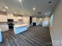 Modern kitchen featuring white cabinets and a spacious island at 624 Cassidy Ct, Clover, SC 29710