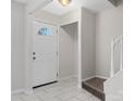 Bright entryway with white door and tiled floor at 7530 Holly Grove Ct, Charlotte, NC 28227