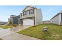 Two-story home with stone and siding exterior, two car garage at 8048 Plymouth Rd, Sherrills Ford, NC 28673