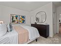 Bright bedroom featuring a round mirror and a modern, comfortable bed at 820 Regulus Ct, York, SC 29745