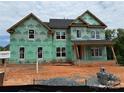 Exterior framing and GreenGuard visible on this home under construction showcasing the progress at 1008 Marquis Hills Dr # Mas0106, Fort Mill, SC 29715