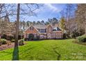 Beautiful brick home with a large, well-maintained front yard and symmetrical design at 1016 Antioch Woods Ln # 36, Weddington, NC 28104