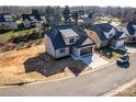 New construction home with a dark gray roof, light-colored brick, and a small yard at 1057 12Th Avenue Nw Dr, Hickory, NC 28601