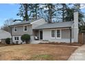 Newly renovated gray house with a well-maintained lawn at 1213 Hartford Ave, Charlotte, NC 28209