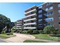 Brick apartment building with landscaping and ample parking at 1300 Reece Rd # G-18, Charlotte, NC 28209