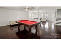 Game room with pool table and hardwood floors at 145 Ashton Woods Ct, Mount Holly, NC 28120