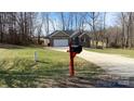 View of the single Gathering home from the driveway, showcasing the brick and siding facade, garage, and front yard at 1790 Kathy St, Newton, NC 28658