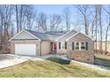 Beautiful home with brick and siding exterior, featuring a two-car garage and covered front entry at 1790 Kathy St, Newton, NC 28658