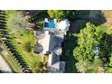 An aerial view of a property showcasing a pool, outdoor kitchen, fire pit, and beautifully landscaped yard at 2270 New Gray Rock Rd, Fort Mill, SC 29708