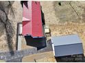 House and detached garage, red metal roof, seen from an aerial perspective at 291 Patterson Farm Rd, Mooresville, NC 28115