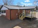 Brick house with new wooden deck and steps at 303 Patterson Farm Rd, Mooresville, NC 28115