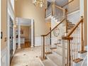 Two-story entryway with a grand staircase and tile flooring at 308 41St Avenue Nw Pl, Hickory, NC 28601