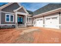 Close up of home entrance and the attached 2 car garage at 6098 Ballard Rd, Denver, NC 28037