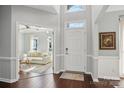 Bright and spacious entryway with hardwood floors and view of living room at 8720 Tamarron Dr, Charlotte, NC 28277