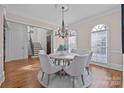 Bright dining room featuring a round table and hardwood floors at 8928 Heydon Hall Cir, Charlotte, NC 28210