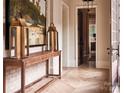 Elegant hallway with herringbone floors, console table, and a view into another room at 961 Jw Wilson Rd, Fort Mill, SC 29715