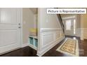 Inviting entryway with built-in bench and storage at 1033 Merganser Way, Indian Trail, NC 28079