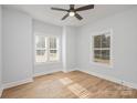 Bright bedroom with hardwood floors and two large windows at 136 Autumn Blaze Rd, China Grove, NC 28023