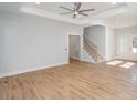 Spacious living room with hardwood floors and a modern staircase at 136 Autumn Blaze Rd, China Grove, NC 28023