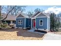 Charming craftsman style home with blue siding and red front door at 140 3Rd Se Ave, Hickory, NC 28602