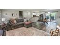 Bright, open-concept living area featuring modern furnishings, a cozy fireplace, and access to the kitchen at 170 Woodcrest Rd, Mooresville, NC 28115