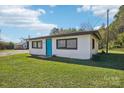 White house with teal door, surrounded by a grassy yard at 2091 & 2095 Catawba River Rd, Fort Lawn, SC 29714