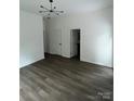 Spacious, empty living room with hardwood floors and ample natural light at 211 Brooklyn Ave, Lancaster, SC 29720