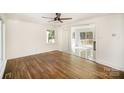 Open concept dining area with hardwood floors and access to deck at 2221 Finchley Dr, Charlotte, NC 28215