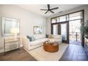 Bright living room with comfy sectional sofa, large windows, and hardwood floors at 2401 Euclid Ave # 110, Charlotte, NC 28203